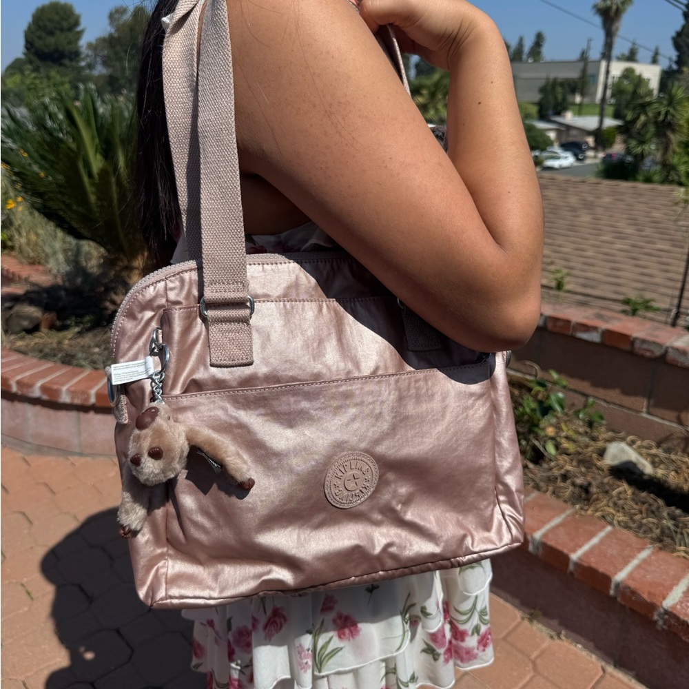 Kipling Metallic Pink Shoulder Bag with Adjustable Straps and Zippered Closures